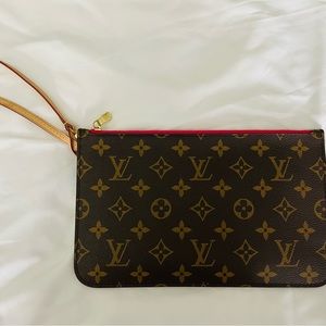 Authentic Louis Vuitton wristlet. Hot pink interior and no signs of wear.